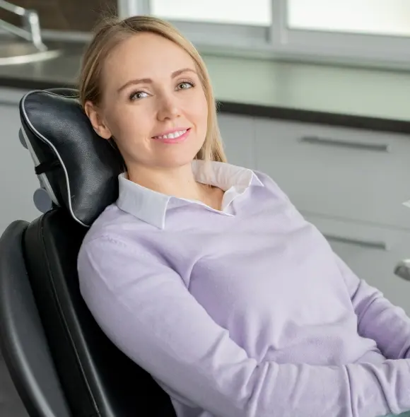 Smiling woman in dental chair at Monterey Park dental practice.